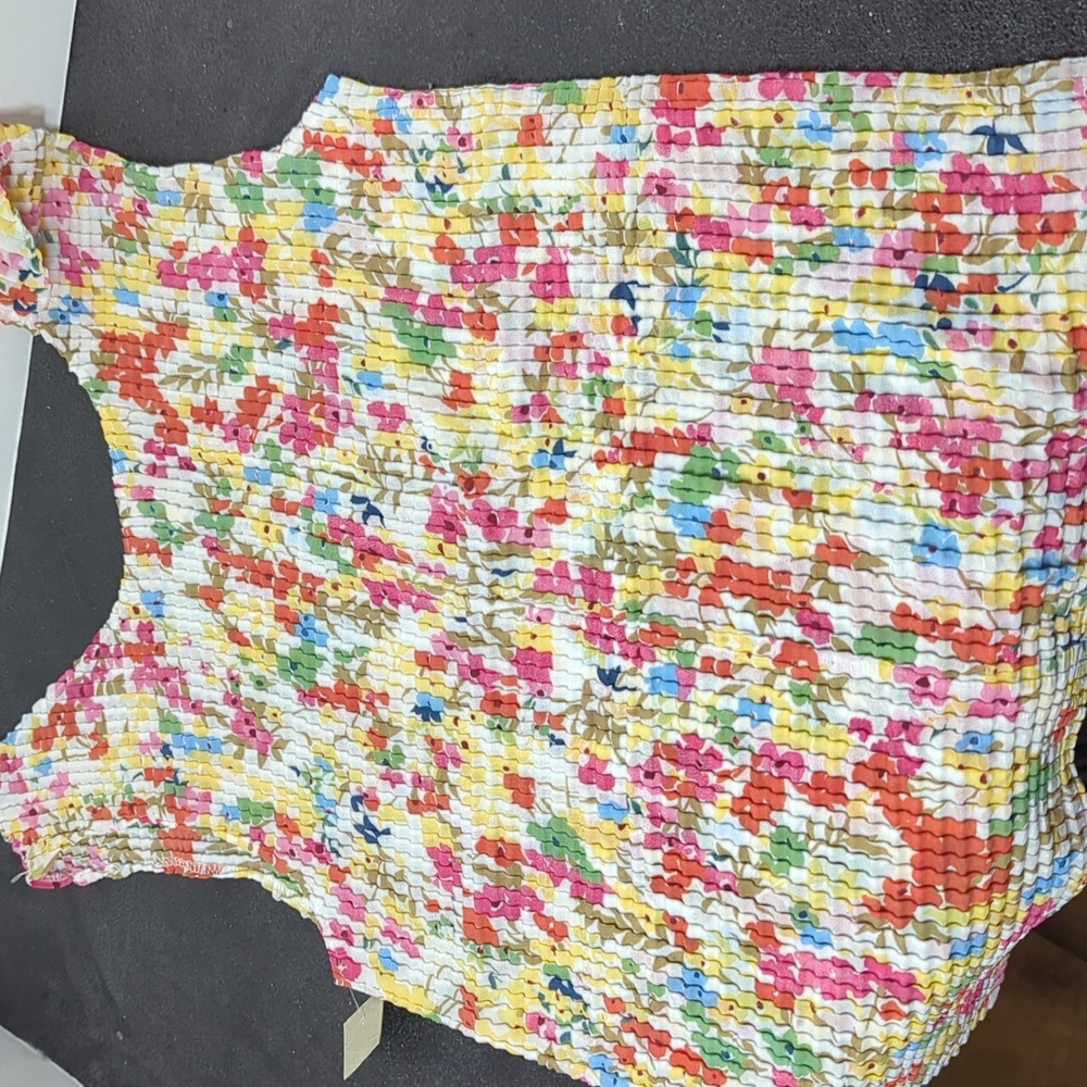 A pair of small size ladies crepe tops